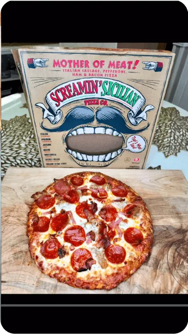 TikTok still of a meat pizza next to a box of Palermos Screamin Sicilian pizza