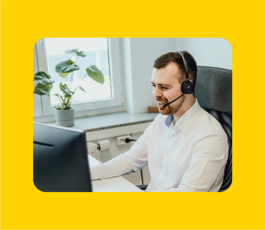 Blog thumbnail image with a man on headset chatting during a virtual meeting on a yellow background